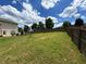Large grassy backyard enclosed by wooden fence, showcasing outdoor space at 1369 Star Water Dr, Lawrenceville, GA 30045