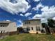 Exterior view of the back of a house with a wooden deck and patio at 1369 Star Water Dr, Lawrenceville, GA 30045