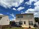 Exterior view of a two-story home with a small deck and fenced-in yard at 1369 Star Water Dr, Lawrenceville, GA 30045