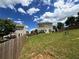 Spacious backyard with a wood fence, green lawn and a deck, perfect for outdoor entertaining at 1369 Star Water Dr, Lawrenceville, GA 30045