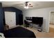 Bedroom with ceiling fan, closet, and desk area at 1369 Star Water Dr, Lawrenceville, GA 30045