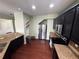 Spacious kitchen featuring dark cabinets, granite countertops, stainless steel appliances, and hardwood floors at 1369 Star Water Dr, Lawrenceville, GA 30045