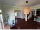 View of front entryway into open concept living room with kitchen, staircase, and large windows at 1369 Star Water Dr, Lawrenceville, GA 30045
