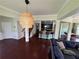 Open concept living room view showcasing eat-in kitchen with barstool seating and staircase access at 1369 Star Water Dr, Lawrenceville, GA 30045