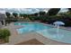 Community pool with lounge chairs and mature landscaping at 1369 Star Water Dr, Lawrenceville, GA 30045