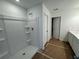New bathroom featuring a modern walk-in shower, sleek vanity, and stylish fixtures, floor covered by paper at 2101 Boxwood Circle Se, Conyers, GA 30094