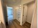 Bathroom with a shower, wood flooring, and a doorway view at 2101 Boxwood Circle Se, Conyers, GA 30094