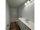 Bathroom features a tub and shower combo, neutral tile, a single sink vanity and neutral wall color at 2101 Boxwood Circle Se, Conyers, GA 30094