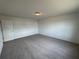 A cozy bedroom features neutral carpet and a light fixture at 2101 Boxwood Circle Se, Conyers, GA 30094