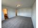 Spacious carpeted bedroom with a door to the bathroom at 2101 Boxwood Circle Se, Conyers, GA 30094