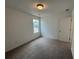 Well-lit bedroom with plush carpeting and natural light, ready to be transformed into a personalized space at 2101 Boxwood Circle Se, Conyers, GA 30094