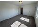 A carpeted bedroom with a view of the door at 2101 Boxwood Circle Se, Conyers, GA 30094
