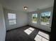 Bright bedroom featuring large windows and neutral carpet, offering a serene atmosphere at 2101 Boxwood Circle Se, Conyers, GA 30094