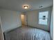 Bedroom with one window offering natural light and neutral wall color, carpet covered by plastic at 2101 Boxwood Circle Se, Conyers, GA 30094