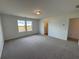 Carpeted bedroom with two windows providing natural light, and a door to the bathroom at 2101 Boxwood Circle Se, Conyers, GA 30094