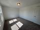 A bedroom with carpet and natural lighting from a window at 2101 Boxwood Circle Se, Conyers, GA 30094