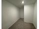 Spacious walk-in closet with neutral walls and carpeted floor covered with plastic at 2101 Boxwood Circle Se, Conyers, GA 30094