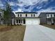 Attractive two-story home featuring a spacious driveway and manicured lawn at 2101 Boxwood Circle Se, Conyers, GA 30094