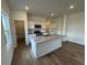 Bright kitchen features stainless appliances, granite counters, an island, and white cabinetry at 2101 Boxwood Circle Se, Conyers, GA 30094