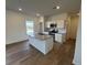 Kitchen features stainless appliances, an island, granite countertops, and wooden floors at 2101 Boxwood Circle Se, Conyers, GA 30094