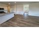 Open concept living space with view of kitchen with granite countertops and stainless appliances at 2101 Boxwood Circle Se, Conyers, GA 30094