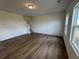 Cozy living area with warm-toned flooring and staircase access, offering a comfortable space at 2101 Boxwood Circle Se, Conyers, GA 30094