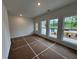Spacious living room featuring a door to outdoor living space and bright windows at 2101 Boxwood Circle Se, Conyers, GA 30094