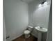 Simple powder room featuring a pedestal sink and modern lighting at 2101 Boxwood Circle Se, Conyers, GA 30094