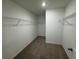 An empty walk-in closet with carpet and metal shelving at 2101 Boxwood Circle Se, Conyers, GA 30094