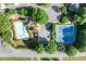 Aerial view of community amenities including a pool and tennis courts surrounded by lush landscaping at 4876 Sara Creek Way, Sugar Hill, GA 30518