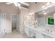 Bright bathroom with double vanity, tile floors, and separate glass shower and bathtub at 4876 Sara Creek Way, Sugar Hill, GA 30518
