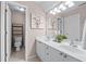 This bathroom features double sinks and bright lighting at 4876 Sara Creek Way, Sugar Hill, GA 30518