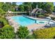 Large community pool area with ample seating and a covered pavilion for residents at 4876 Sara Creek Way, Sugar Hill, GA 30518
