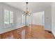 Elegant dining room with hardwood floors, wainscoting, and shuttered windows at 4876 Sara Creek Way, Sugar Hill, GA 30518