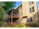 View of the home's exterior, including a deck and screened-in porch at 4876 Sara Creek Way, Sugar Hill, GA 30518