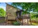 Home exterior featuring a deck and screened-in porch overlooking the backyard at 4876 Sara Creek Way, Sugar Hill, GA 30518