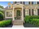 Inviting front porch with brick steps and trim details, leading to a screened door entry at 4876 Sara Creek Way, Sugar Hill, GA 30518