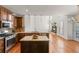 Spacious kitchen features stainless steel appliances and wood cabinets at 4876 Sara Creek Way, Sugar Hill, GA 30518
