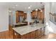 Beautiful kitchen with wood cabinets, granite countertops, stainless steel appliances, and a functional center island at 4876 Sara Creek Way, Sugar Hill, GA 30518