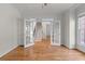 Living room features hardwood floors, and a set of french doors leading to another room at 4876 Sara Creek Way, Sugar Hill, GA 30518