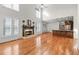 Spacious living room featuring a fireplace and a kitchen, creating an inviting and comfortable open layout at 4876 Sara Creek Way, Sugar Hill, GA 30518
