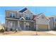 Charming brick two-story home featuring a front porch and attached two car garage at 680 Redhead Way(Lot 22), Grayson, GA 30017