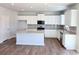 Modern kitchen featuring stainless appliances, granite countertops, and white cabinetry at 680 Redhead Way(Lot 22), Grayson, GA 30017