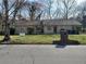 Charming single-story home with a well-maintained lawn, brick mailbox, and a 'For Sale' sign at 867 Commodore Nw Dr, Atlanta, GA 30318