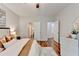 Bright bedroom featuring wood floors and white trim, with doorways leading to the bathroom and hallway at 1112 Birch Sw St, Atlanta, GA 30310