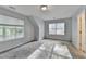 Bedroom features neutral walls, carpeted floors, and windows providing natural light at 1112 Birch Sw St, Atlanta, GA 30310