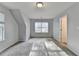 Bedroom features neutral walls, carpeted floors, and a large window providing natural light at 1112 Birch Sw St, Atlanta, GA 30310
