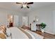 Comfortable bedroom featuring wood floors and doorways to bathroom and hallway at 1112 Birch Sw St, Atlanta, GA 30310