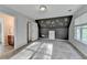 Bright bedroom with neutral walls, carpeted floors, with an adjacent door to a bathroom and closet at 1112 Birch Sw St, Atlanta, GA 30310