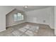 Spacious bedroom featuring neutral walls, carpeted floors, and a window providing natural light at 1112 Birch Sw St, Atlanta, GA 30310